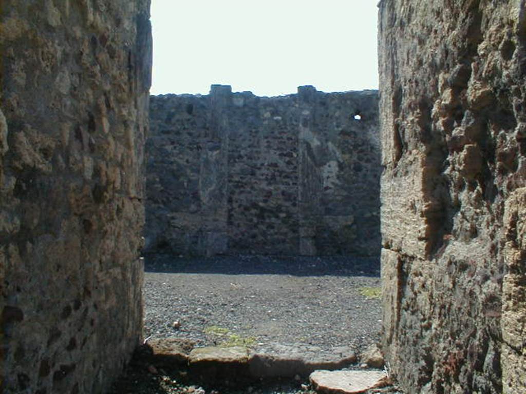 VI.6.9 Pompeii. September 2004. Looking towards rear wall, according to Fiorelli near the west wall was a stairs to upper floor with cupboard below.
