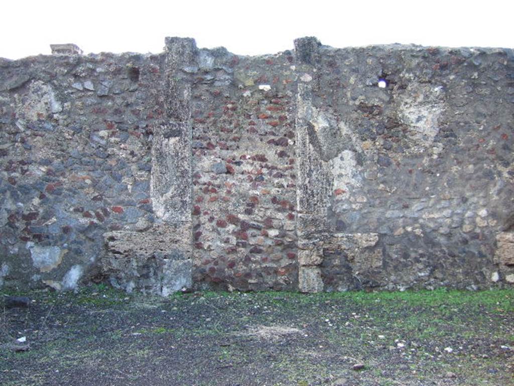 VI.6.9 Pompeii. December 2005. West wall of atrium, with blocked doorway that originally would have led into the peristyle of VI.6.1.