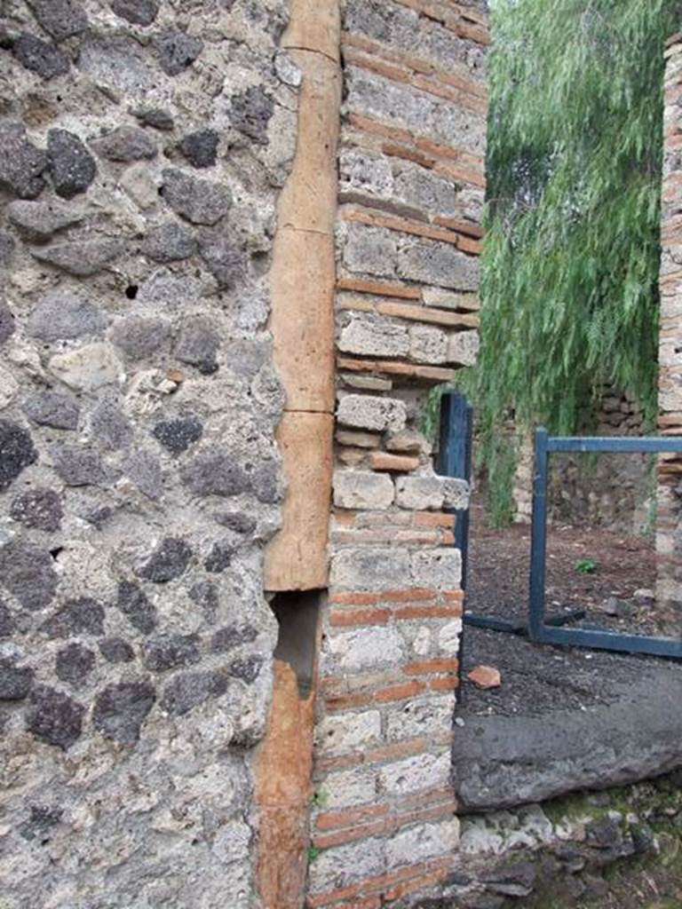 Pipe in wall at side of VI.6.10 Entrance.