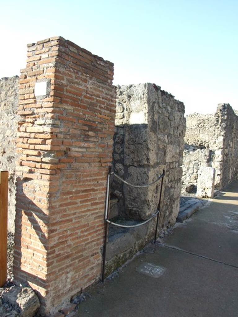 VI.7.12 Pompeii. December 2007. Entrance to steps to upper floor, looking north along Via di Mercurio.