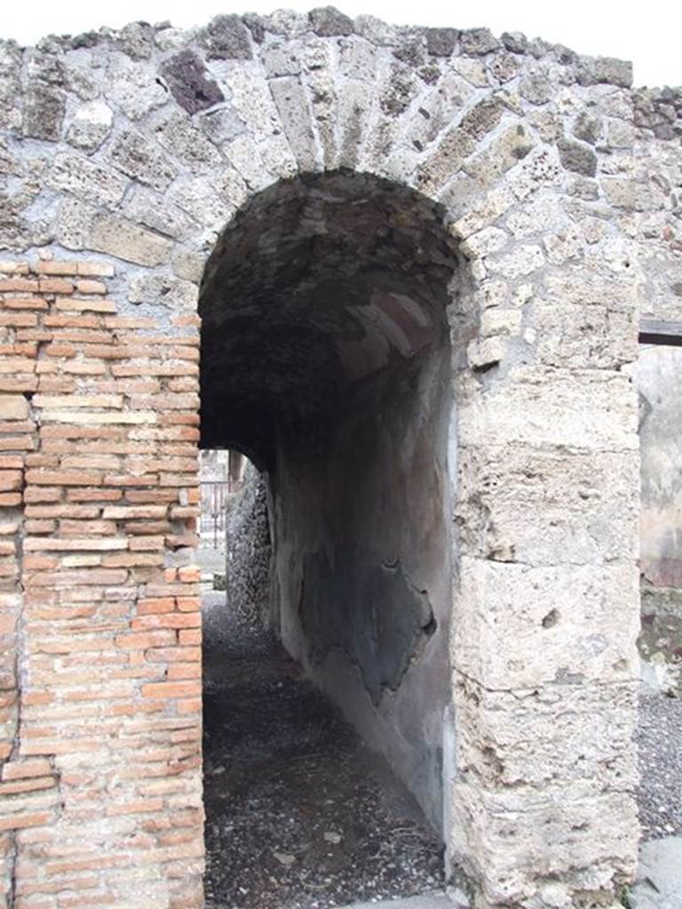 VI.7.20 Pompeii. December 2006. Looking east in room in north-east corner of peristyle.
On the left is the east wall of the small oecus. The doorway in the wall on the left leads to the corridor linking with VI.7.22


