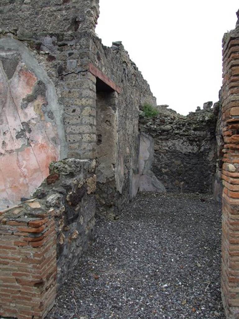 VI.7.20 Pompeii. December 2006. Looking east in room in north-east corner of peristyle.
On the left is the east wall of the small oecus. The doorway in the wall on the left leads to the corridor linking with VI.7.22


