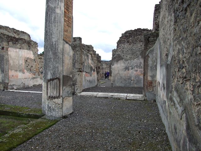 VI.7.20 Pompeii. December 2006. Looking east from south portico.On the upper left is the north wall of the tablinum leading through to the atrium. In the centre, is the large oecus and doorway into the atrium.
