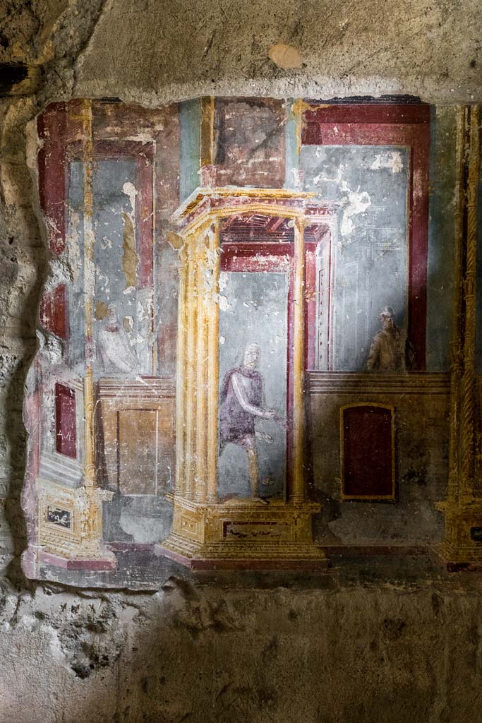 VI.7.23 Pompeii. July 2021. 
Looking towards south alcove, east wall with paintings of a central male figure in oriental attire and figures at balconies. 
Photo courtesy of Johannes Eber.
