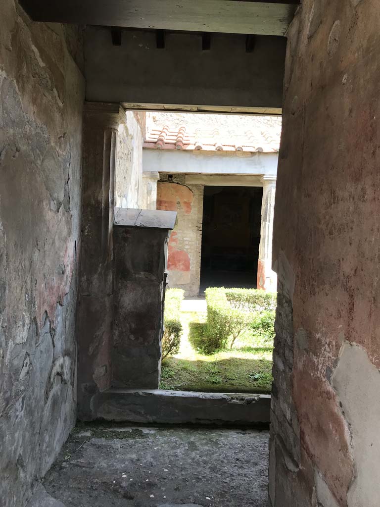 VI.8.3/5 Pompeii. April 2019. 
Looking east along entrance corridor towards peristyle garden, from rear side doorway. 
Photo courtesy of Rick Bauer.

