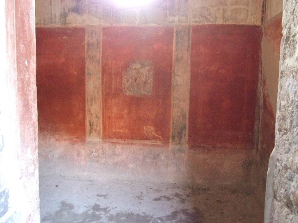 VI.8.3 Pompeii. December 2006. Doorway to room 15, looking towards west wall with square window. The dado was black with painted plants in separated panels. The middle zone was red separated by black bands. In the middle of the central zone was a painting of Narcissus, now faded and unrecognisable. The upper area was white with architectural designs, and a stucco cornice.
See Bragantini, de Vos, Badoni, 1983. Pitture e Pavimenti di Pompei, Parte 2. Rome: ICCD. (p.173)
See Helbig, W., 1868. Wandgemälde der vom Vesuv verschütteten Städte Campaniens. Leipzig: Breitkopf und Härtel. (1352)
According to Breton, when excavated, the painting of Narcissus was already faded and ruined. 
See Breton, Ernest. 1870. Pompeia, Guide de visite a Pompei, 3rd ed. Paris, Guerin. 
