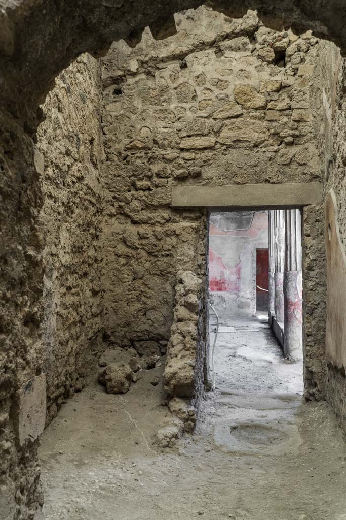 VI.8.3/5 Pompeii. April 2022. 
Room 13, looking west towards latrine, on left, near doorway to peristyle. 
Photo courtesy of Johannes Eber.

