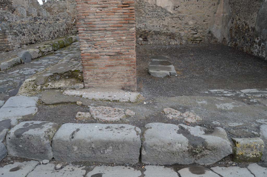 VI.8.4 Pompeii. March 2018. Looking north to pavement at junction of Via delle Terme and Vicolo della Fullonica, on west side of doorway.  
Foto Taylor Lauritsen, ERC Grant 681269 DÉCOR.

