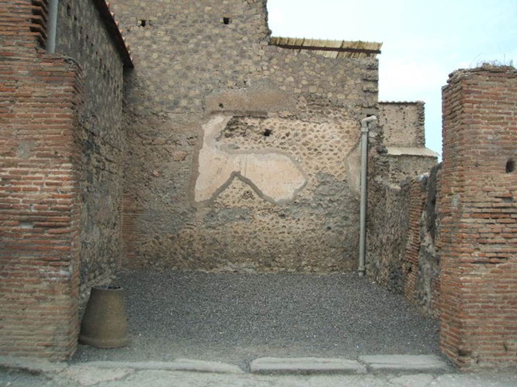 VI.8.6 Pompeii. May 2005. Looking north to shop entrance doorway.
According to Eschebach, on the right at the rear were stairs to the upper floor.
On the left was a doorway linking with the entrance corridor of VI.8.5.
See Eschebach, L., 1993. Gebudeverzeichnis und Stadtplan der antiken Stadt Pompeji. Kln: Bhlau. (p.183)
According to De Jorio 
Nella bottega a diritta del protyrum allaltezza di sei palmi dal suolo si rinvennero i resti dellelegante pavimento a musaico della stanza superiore, quattro armille, due collane, e due orecchini di oro. La opposta bottega contenea varii utensili di bronzo, di terracotta, di ferro, e die osso.
(Trans: In the shop on the right of the entrance corridor, at the height of six palms (1.58m) above the ground, were found the remains of the elegant mosaic floor of the upper room, four arm-bands, two necklaces, and two gold earrings. The opposite shop (VI.8.4) contained various utensils of bronze, of terracotta, of iron, and of bone.")
See De Jorio A., 1836. Guida di Pompei. Napoli: Fibreno, (p. 99).
