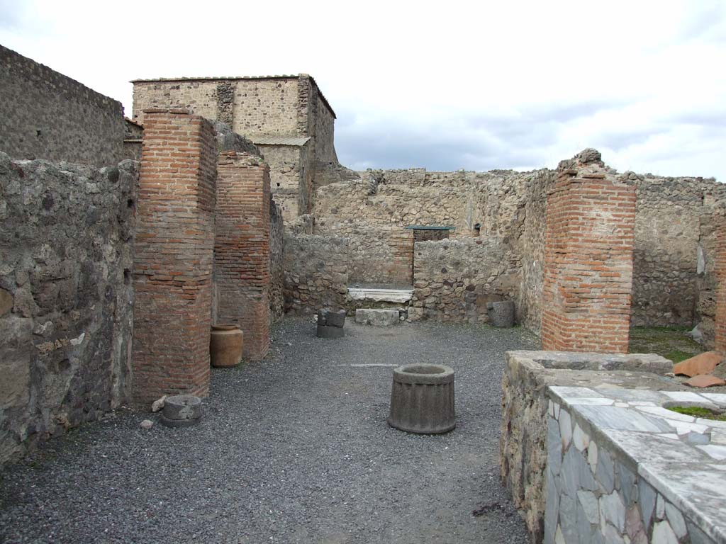 VI.8.9 Pompeii. December 2018. Looking north-east across counter in bar-room. Photo courtesy of Aude Durand.