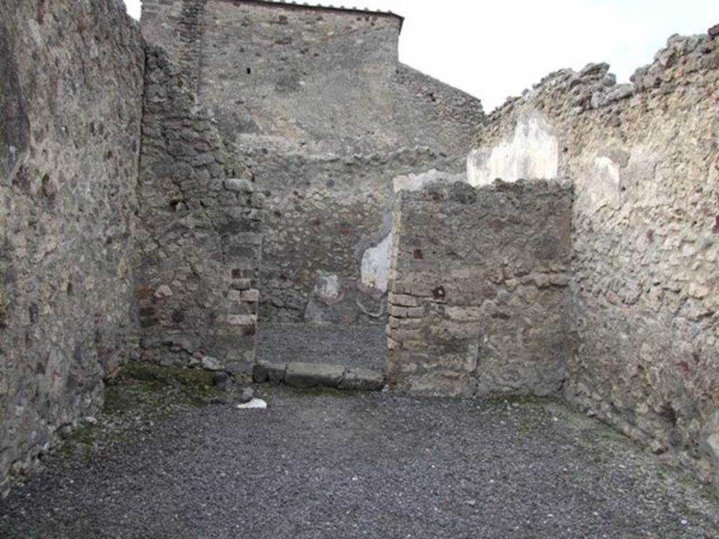 VI.8.16 Pompeii. December 2007. West wall of shop room, and doorway to rear room.
