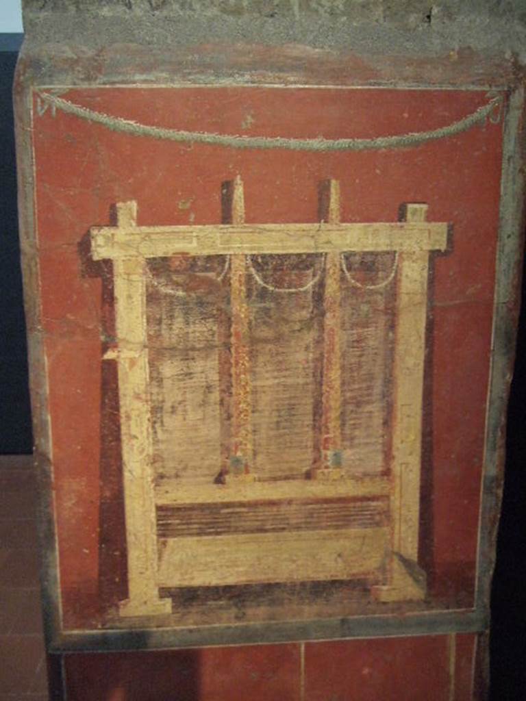 Pillar found in the Fullonica at VI.8.20.   Painting of fuller’s press for drying the wet cloths.  Now in Naples Archaeological Museum.  Inventory number 9974.