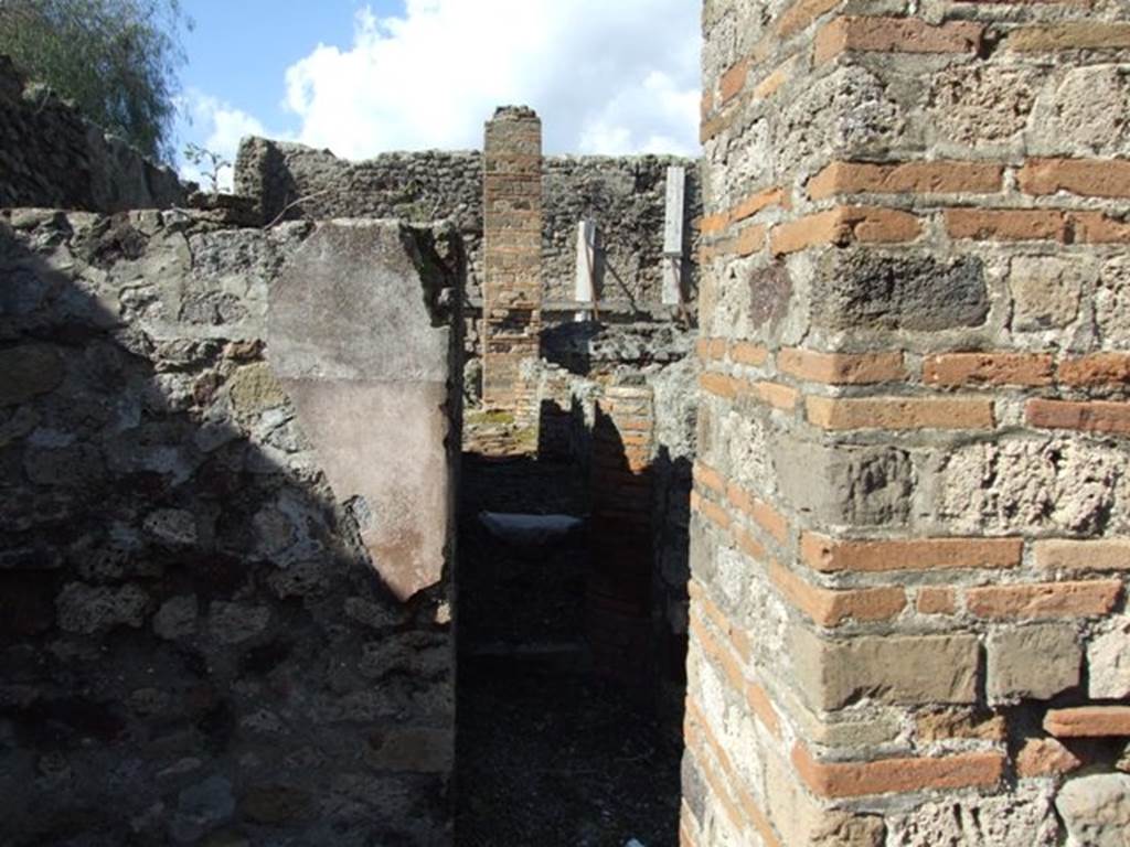 VI.8.20 Pompeii. March 2009.  Looking north along front of vats on west side of peristyle.