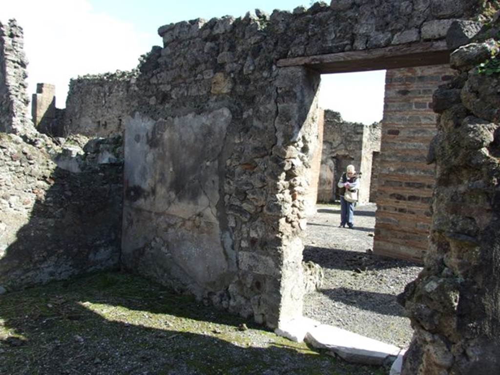 VI.8.21 Pompeii. March 2009. Looking through linked door to VI.8.20 in south-west corner of atrium.