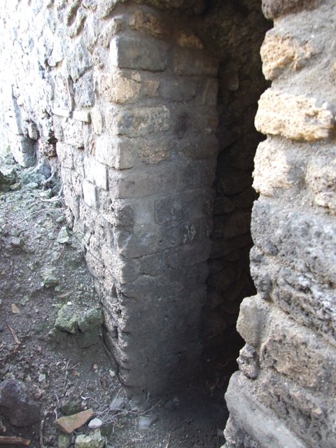 VI.8.22 Pompeii. May 2017. Room 6, portico area at south end of garden, and doorway to small room under stairs on left. Photo courtesy of Buzz Ferebee.
