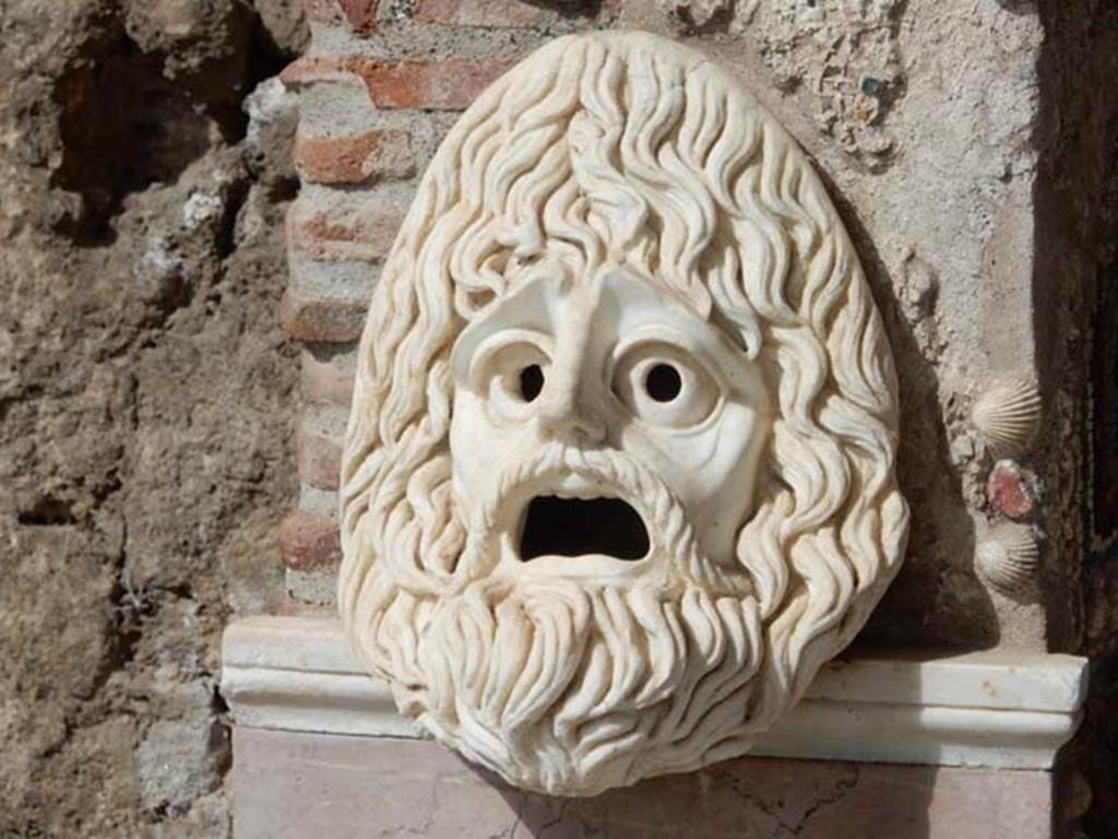 VI.8.22 Pompeii. May 2017. Hollow marble mask on south side of fountain, after restoration.  Photo courtesy of Buzz Ferebee.

