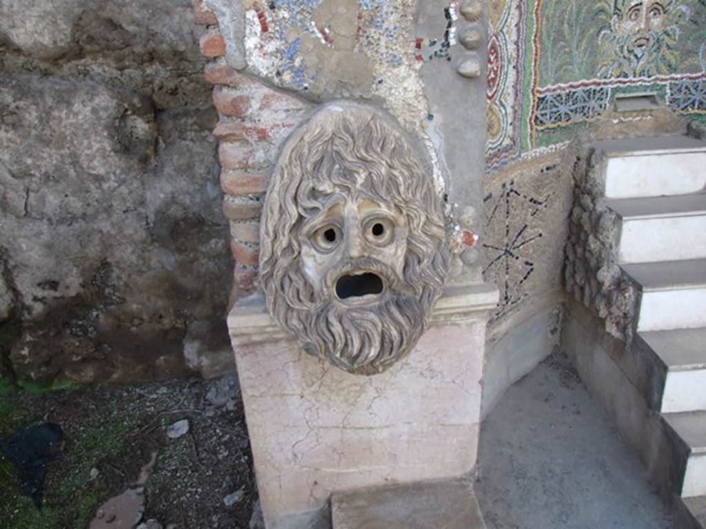 VI.8.22 Pompeii. March 2009. Hollow marble mask used as a lamp at night on south side of fountain.