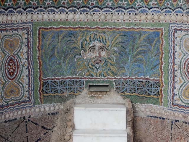 VI.8.22 Pompeii.  March 2009.  Detail of fountain, with centre panel of a mask of a river god surrounded by plants.