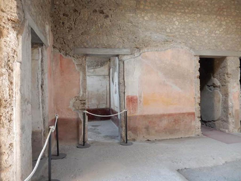 VI.8.24 Pompeii. May 2017. Looking towards south wall of atrium.
On the right is the doorway linking to a room in VI.8.23. 
In the centre is a doorway into the triclinium.
Looking towards south-east corner of the atrium from entrance doorway, on left, in east wall.
Next to the entrance corridor is the doorway to the cubiculum on south side of entrance doorway. Photo courtesy of Buzz Ferebee.


