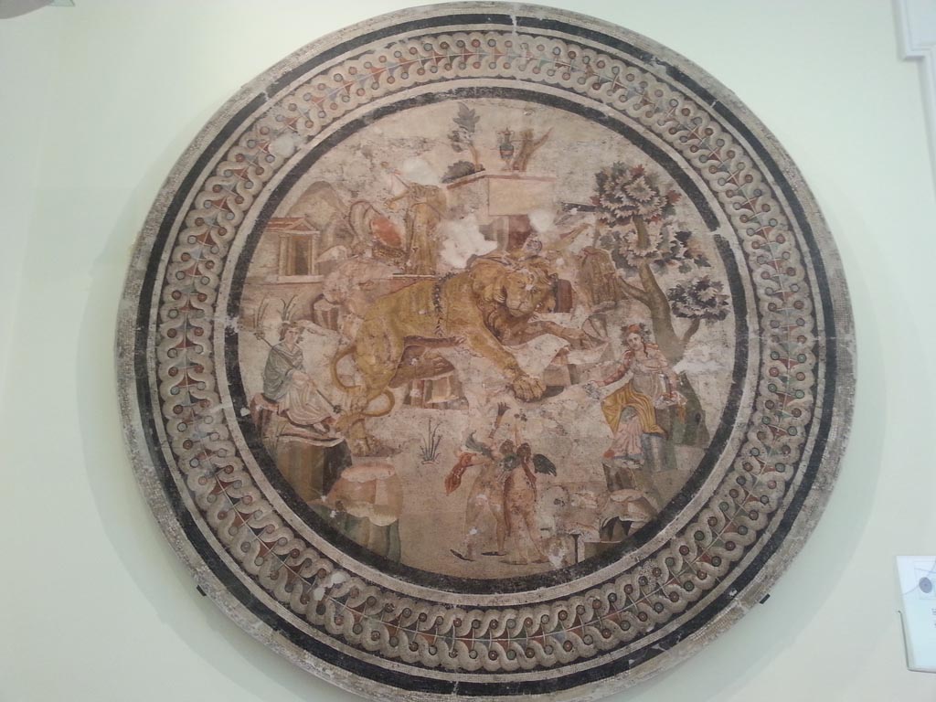 VI.9.5, Pompeii. August 2016. 
Mosaic of lion and cupids between Dionysus and maenads, found in April 1829 in triclinium 27. Photo courtesy of Maribel Velasco.
Now in Naples Archaeological Museum. Inventory number 10019. 

