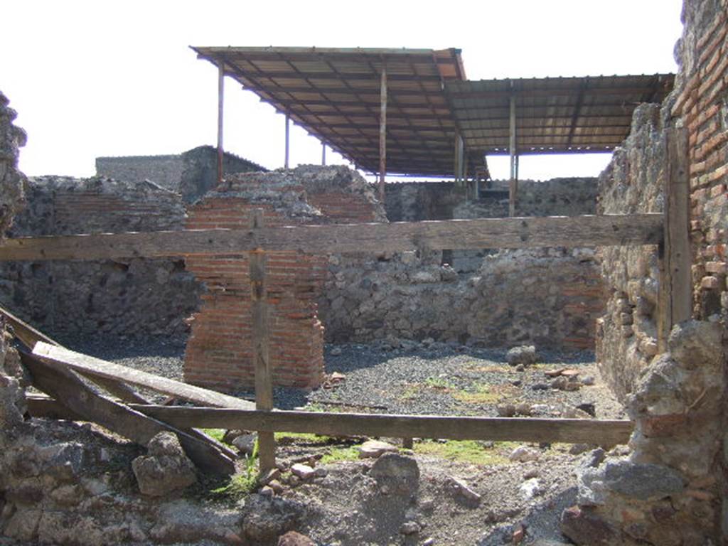VI.9.8 Pompeii. September 2005. Looking west towards central pilaster, from entrance.
