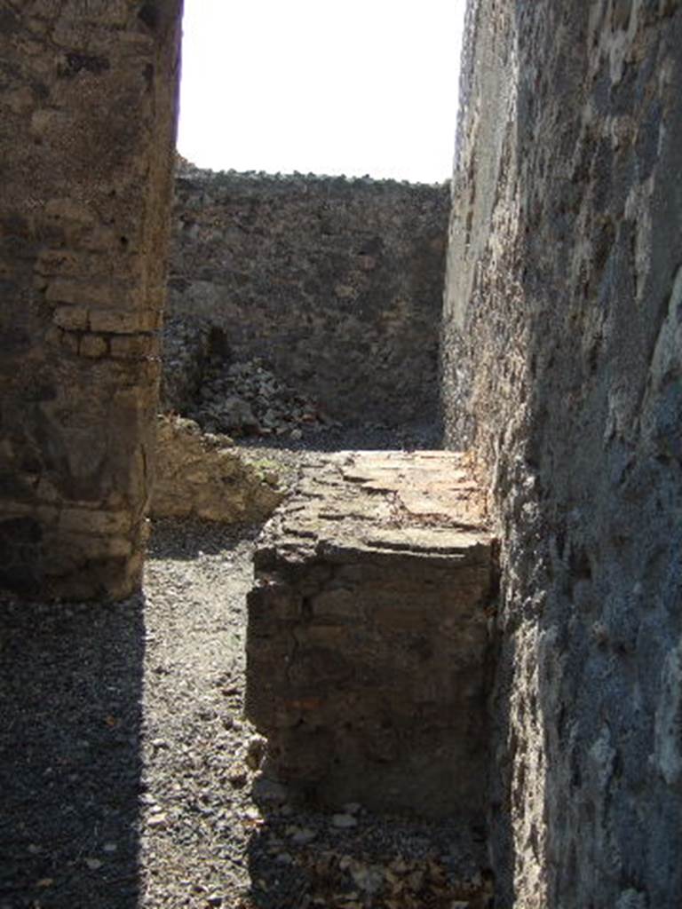 VI.9.12 Pompeii. September 2005. Looking west towards room 37, kitchen at front, and storeroom 36, at rear.

