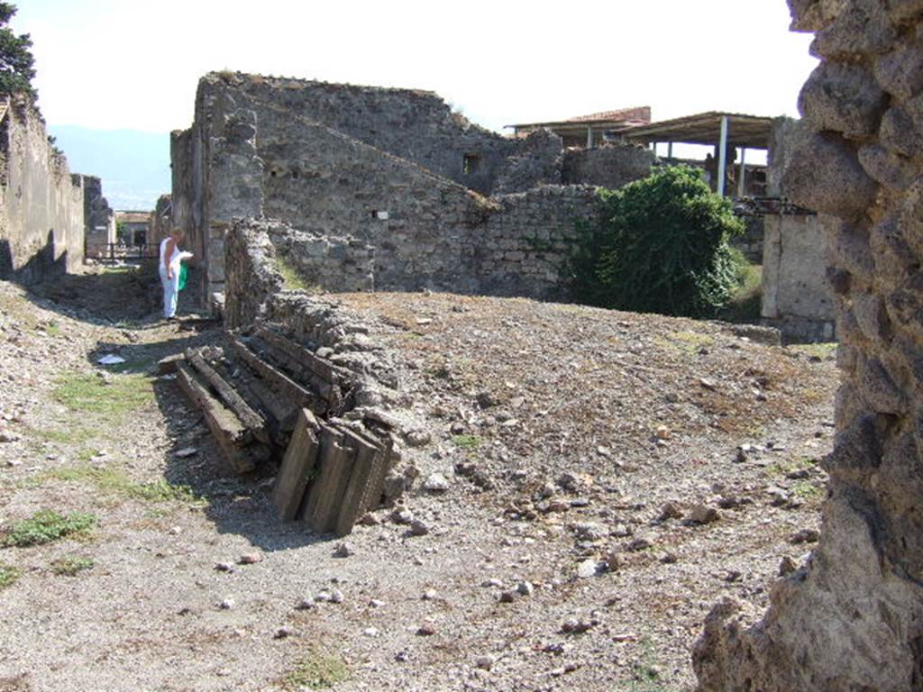VI.9.12 Pompeii. September 2005. Looking south along Vicolo del Fauno, from near gap in rear wall of VI.9.5