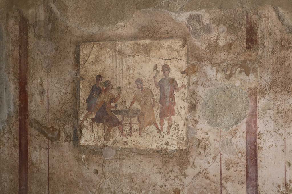 VI.10.1 Pompeii. December 2018. 
Fresco from east end of south wall of rear room, showing men gambling. Photo courtesy of Aude Durand.

