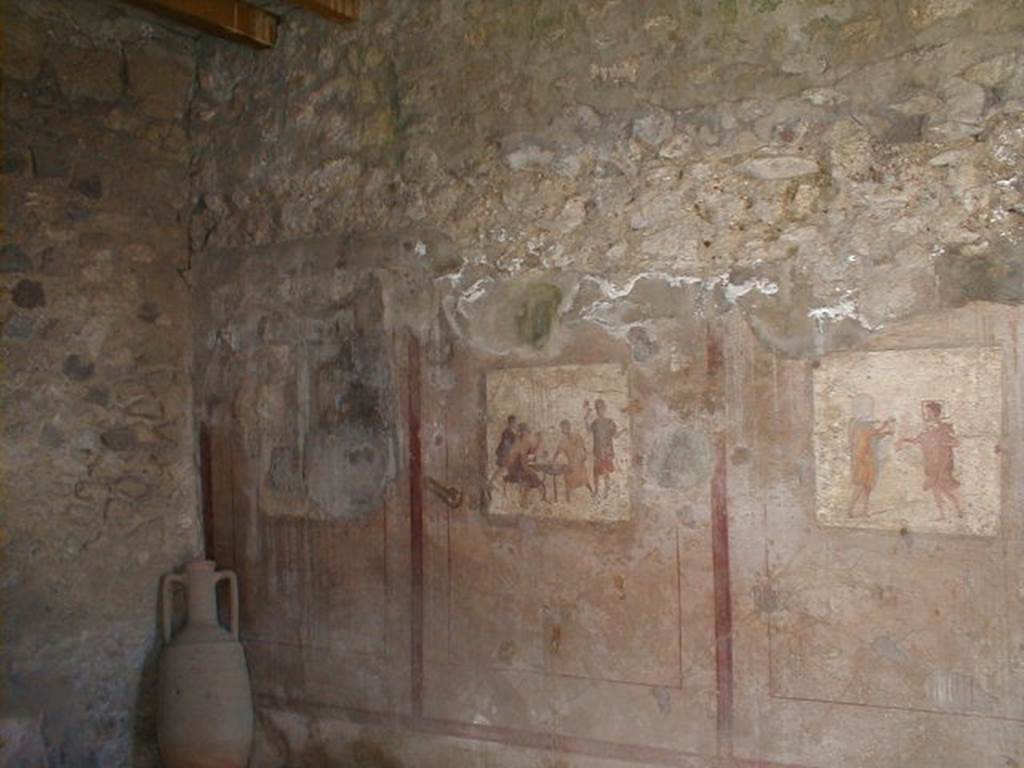 VI.10.1 Pompeii. May 2004. Frescoes on south wall of rear room on north side.