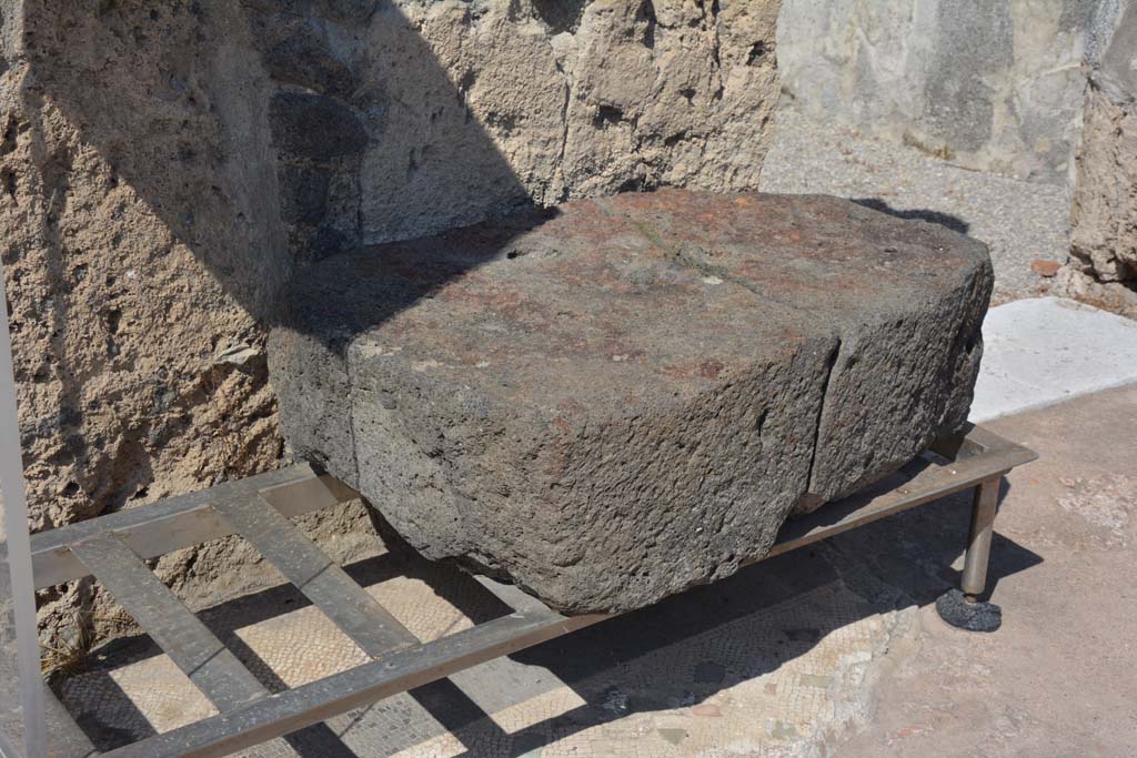 VI.10.7 Pompeii. May 2017. Room 1, the large lava stone base for the strongbox on the north side of the atrium.  Photo courtesy of Buzz Ferebee.
