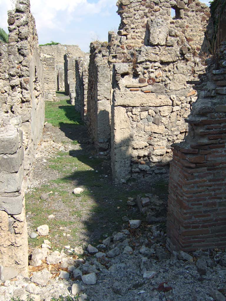 VI.11.6 Pompeii. September 2005. Looking east from entrance along long corridor.