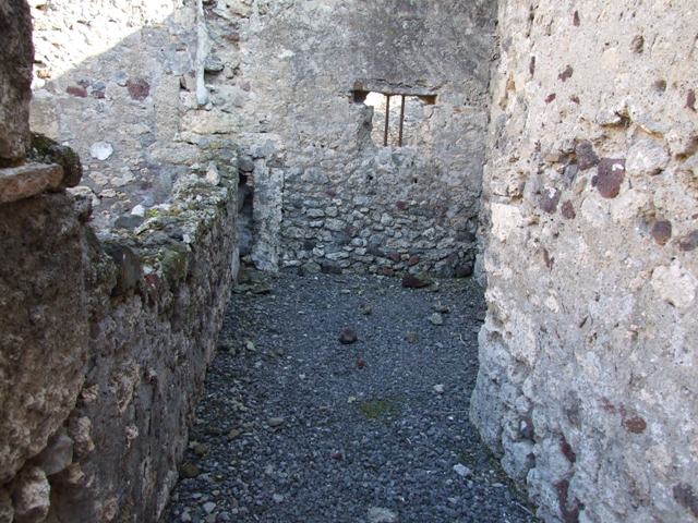 VI.11.8 Pompeii. December 2007. Room 50, looking west.  
Against the north wall, on right, would have been the stairs to the upper floor, and in the north-west corner under the stairs is the latrine. 
On the left, against the south wall was probably a hearth or a bench. 
