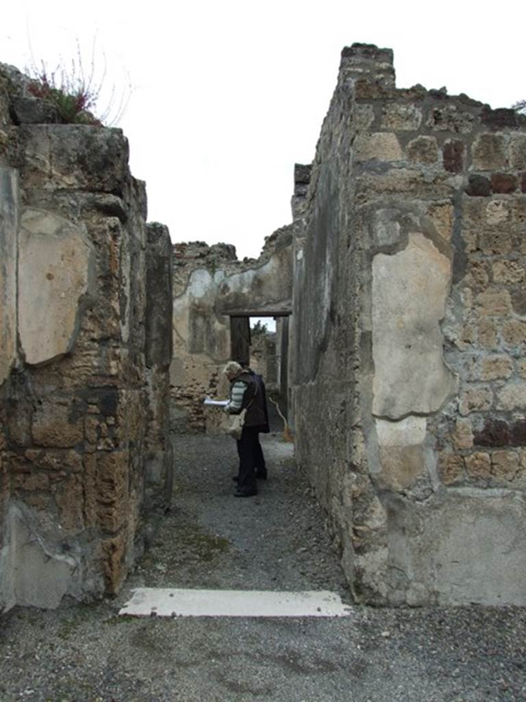 VI.11.9 Pompeii. March 2009. 
Doorway to, corridor 15 on north side of atrium leading to services, baths and bakery area.




