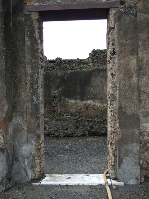 VI.11.9 Pompeii.  December 2006.   Long corridor leading to servants’ quarters, bakery and small baths area.
