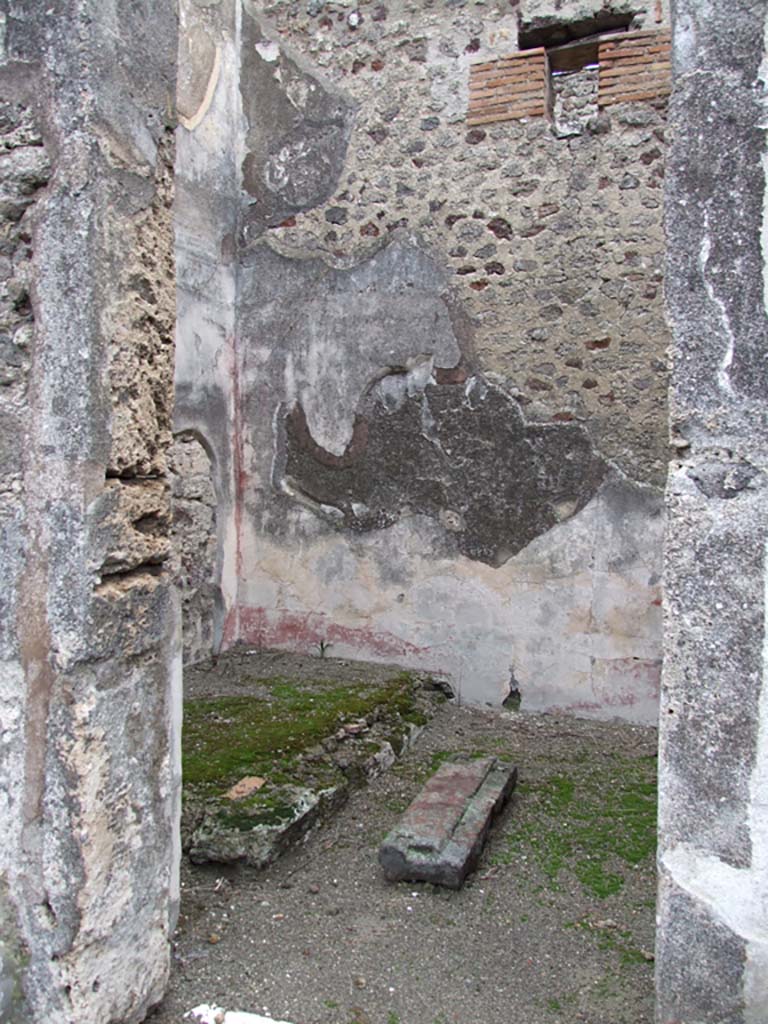 VI.11.10 Pompeii. December 2007. Doorway to room 17. Looking north into oecus in north-west corner of peristyle.
