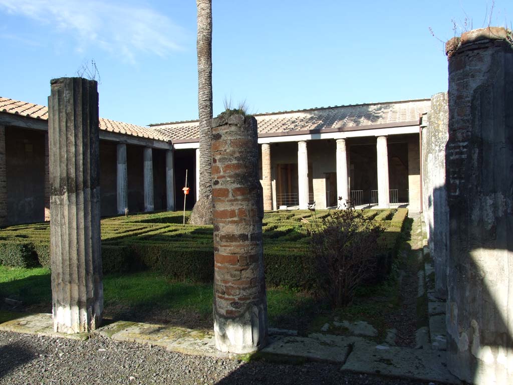 VI.11.10 Pompeii. December 2007. Room 36, peristyle. Looking north.
According to Della Corte, he hypothesised that a certain Eutychi could have been the faithful servant/procurator of the owner, who he named as Fuficius Januarius. He surmised that Eutychi had stayed too long before fleeing from the eruption.
A skeleton was found in the lapilli, high up above the peristyle of VI.11.9/10, with a group of precious objects together with a key and seal registered to him and with the letters – Eutychi 
See Della Corte, M., 1965. Case ed Abitanti di Pompei. Napoli: Fausto Fiorentino. (p.44)

According to G. Luongo et al, a skeleton found above the peristyle was a woman.
See Luongo, G. et al. (2003): Journal of Volcanology and Geothermal Research 126, (p.195)

According to Pagano and Prisciandaro, found in March 1835 in the middle of the peristyle but high above the original soil level was a skeleton.
Nearby were two gold circles, perhaps armbands or bracelets, (MN 24992 and 24993); three gold rings and an iron key, together with a bronze seal with an inscription –
Euti
chi        [CIL X 8058,33]
These objects are now in Naples Archaeological Museum, inventory numbers 4755, 25830, 25831, 25832.
See Pagano, M. and Prisciandaro, R., 2006. Studio sulle provenienze degli oggetti rinvenuti negli scavi borbonici del regno di Napoli. Naples: Nicola Longobardi, p.150 PAH, II, 304-5.

