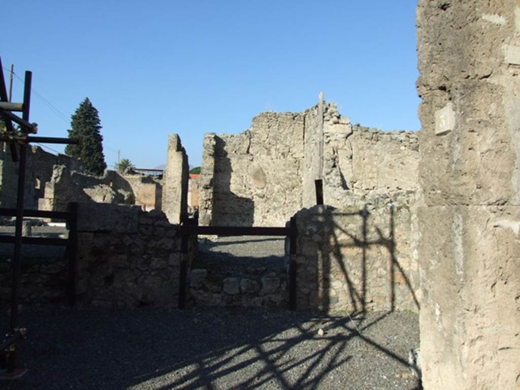 VI.13.3 Pompeii. December 2007. Doorway on right side of north wall of shop, leading to the site of a cubiculum of VI.13.2, bombed in 1943.  