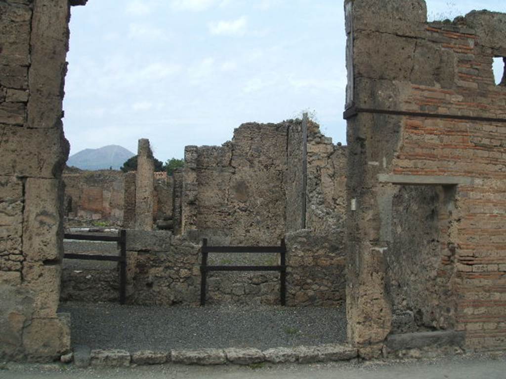 VI.13.4 Pompeii, on right. December 2005. The separate entrance to stairs to the upper floor is on the right.