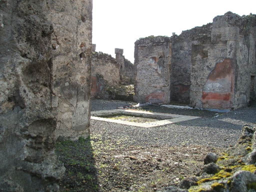 VI.13.8 Pompeii. December 2004. Looking south-west from rear entrance, towards atrium. According to Garcia y Garcia, in 1943 a bomb destroyed the rear entrance. The three nearby rooms on the south-east side of the peristyle were destroyed as well as a good part of the east wall. See Garcia y Garcia, L., 2006. Danni di guerra a Pompei. Rome: L’Erma di Bretschneider. (p.86-87)
According to Della Corte, the peristyle was transformed into a weaving workshop, probably after the earthquake of 62AD. The workers took time to scratch their names in the portico.  The names of seven men were found - Vesbius or Vesbius Tamudianus, Felix, Ephesus, Xanthus, Successus, Faustus, and Florus: The  names of eleven women were found - Vitalis, Florentina, Amaryllis, Ianuaria, Heracla, Maria, Lalage, Damalis,  ….rusa,  .a., Baptis, and Doris.  Della Corte noted that two of the names were Jewish – that of Maria, and Vesbius Tamudianus.    
See Della Corte, M., 1965.  Case ed Abitanti di Pompei. Napoli: Fausto Fiorentino. (p.121) [CIL IV (1493-1509]  
According to Epigraphik-Datenbank Clauss/Slaby (See www.manfredclauss.de), these read as –
Vesbius Tamudianus     [CIL IV 1493]
Pottttas 
X                  [CIL IV 1494]
Vesbius     [CIL IV 1495]
Quibusos  [CIL IV 1496] 
Felix           [CIL IV 1497]
Felix           [CIL IV 1498]
Nero Poppaeeses istis   [CIL IV 1499] 
Cum           [CIL IV 1500]
Vibius        [CIL IV 1501]
Mamoe      [CIL IV 1502] 
Ephesus 
Fututor      [CIL IV 1503] 
Felix           [CIL IV 1504] 
Xanthus    [CIL IV 1505]
Successus     [CIL IV 1506]
Maria pe(nsi) stamen       [CIL IV 1507] 
Nua[3] 
Procu/lus hoc                    [CIL IV 1508]
Faustus Felix F[l]oru(s)   [CIL IV 1509]


