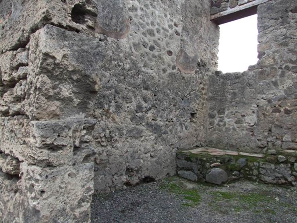 VI.13.14 Pompeii. December 2007. South wall and south-west corner with possible steps to upper floor in front of blocked door.

