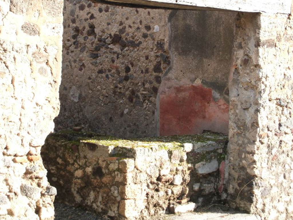 VI.13.17 Pompeii. December 2004. Entrance doorway with bar-counter, and remains of painted plaster.