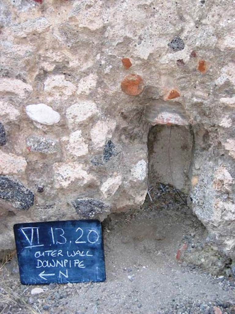 VI.13.20 Pompeii. July 2008. Remains of downpipe in exterior wall on north side of entrance doorway. Photo courtesy of Barry Hobson.