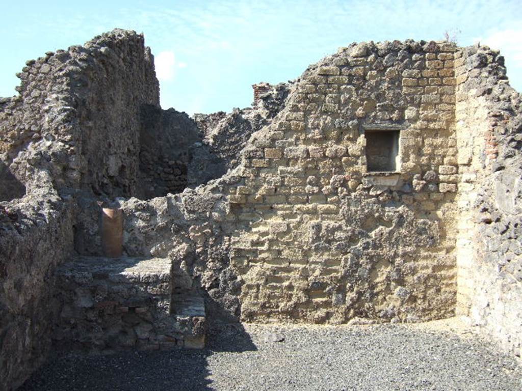 VI.14.4 Pompeii. October 2020. North-west corner with base of steps to upper floor, and downpipe at rear. Photo courtesy of Klaus Heese.

