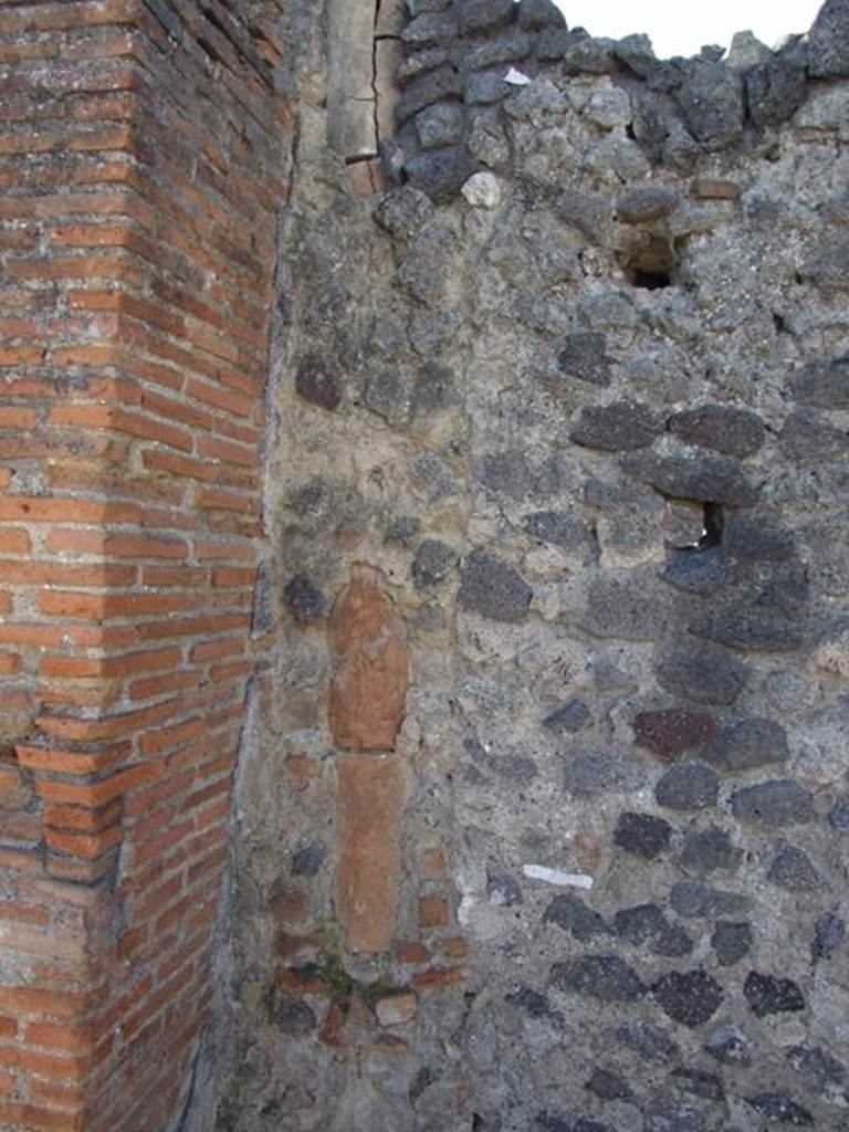 VI.14.7 Pompeii. December 2007. Down-pipe in wall at south-west corner of shop.