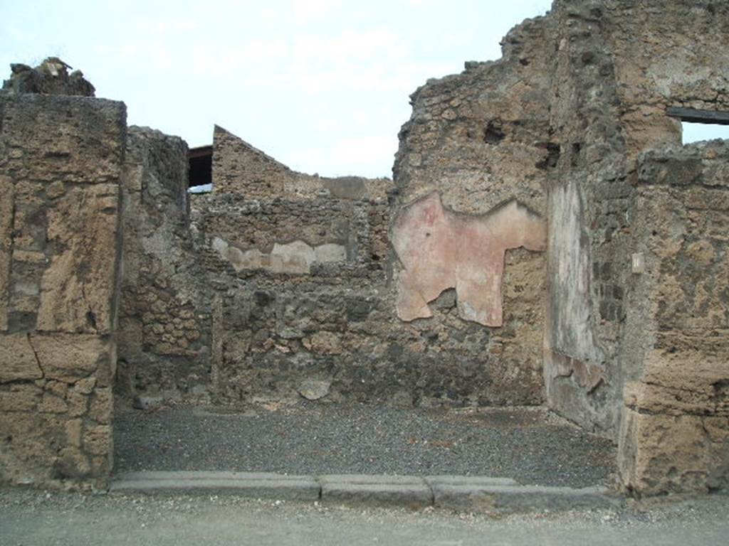 VI.14.10 Pompeii. May 2005. Shop entrance doorway, looking north.