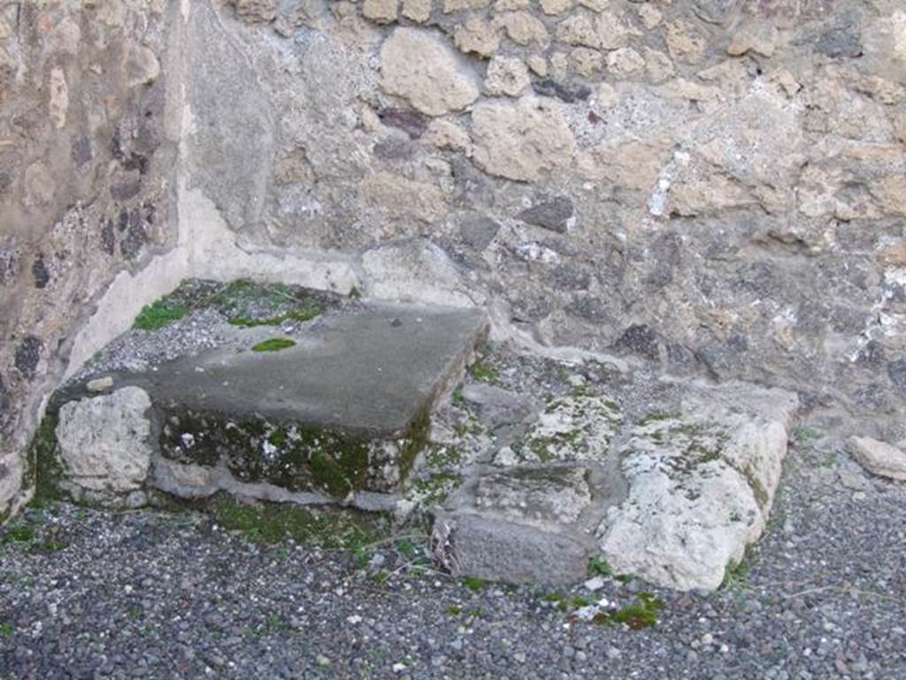 VI.14.14 Pompeii. December 2007. Stone base of wooden staircase to upper storey, in north-west corner near north wall of shop.