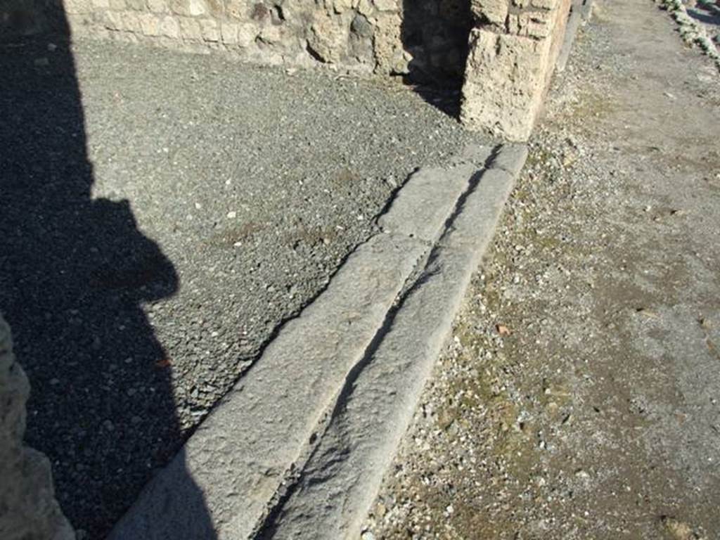 VI.14.14 Pompeii. December 2007. Threshold or sill at front of shop with groove for wooden shutters.