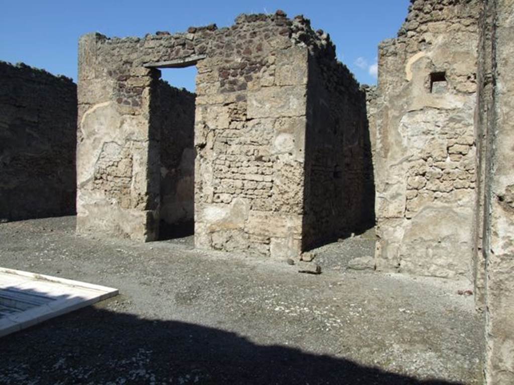 VI.14.20 Pompeii. March 2009. Room 1, looking north across atrium, towards doorways to rooms 6 and 7 and 8, from south side..