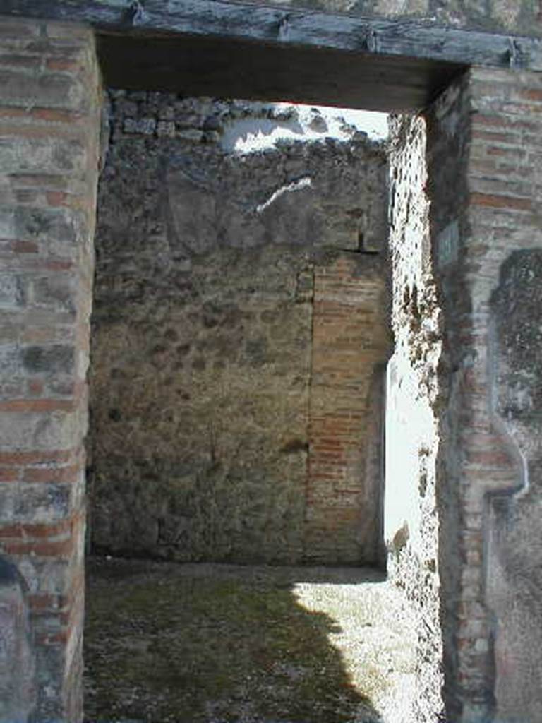 VI.14.29 Pompeii. May 2005. Looking west through entrance doorway.
According to Wallace-Hadrill, originally this would have been a room from VI.14.30 on the south side of the fauces. It had Style III decoration.
See Wallace-Hadrill, A. (1994): Houses and Society in Pompeii and Herculaneum. Princeton Univ. Press, (p. 213)
