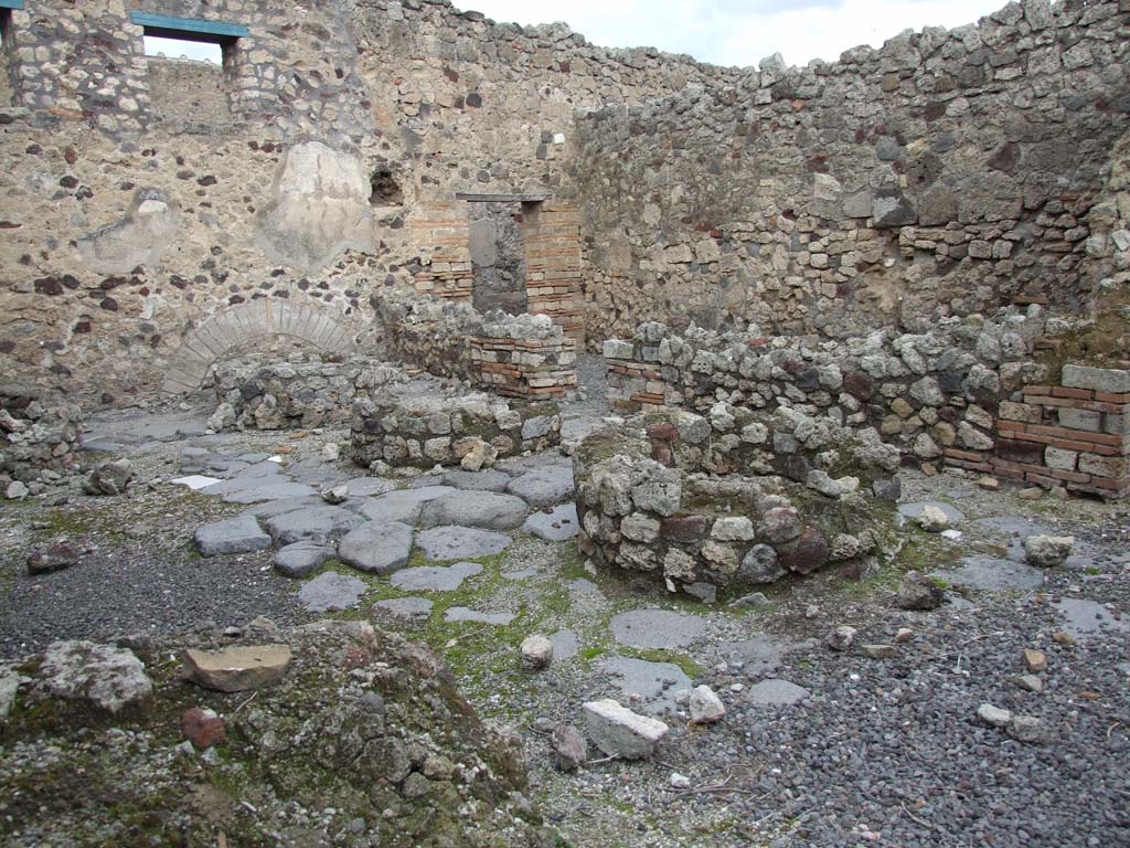 VI.14.34 Pompeii. December 2007. Looking north-east across bakery and remains of mills, towards entrance at VI.14.33.